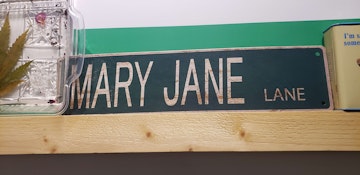Mary jane metal sign